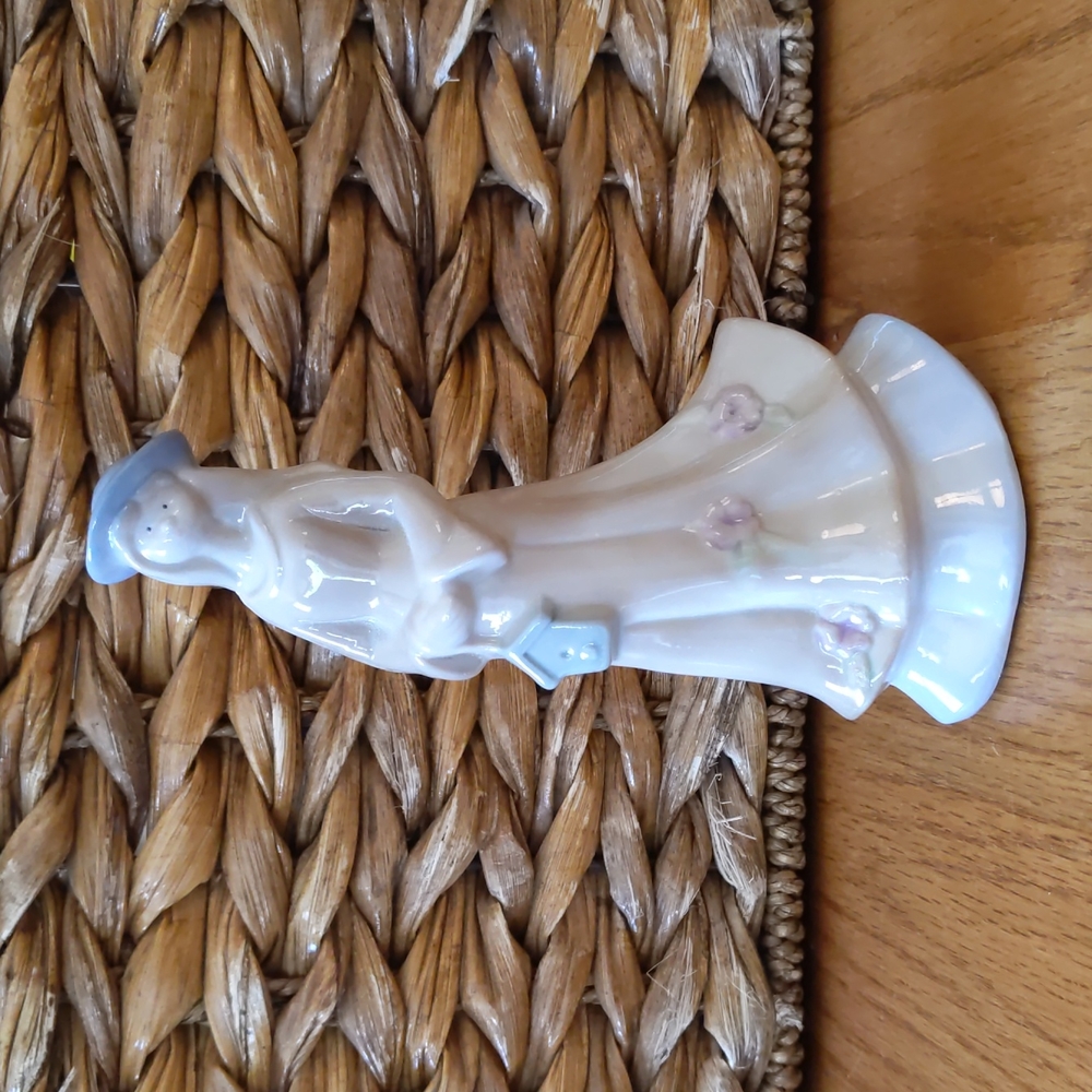 Porcelain Woman Holding Birdhouse